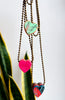 Necklace with heart-shaped colorful pendants on a white background