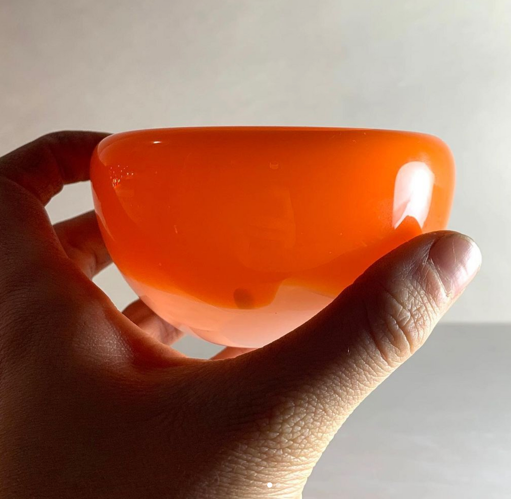 Hand holding glass bowl