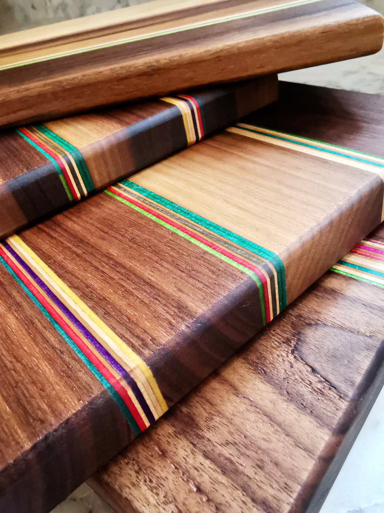 stack of skateboard cutting boards